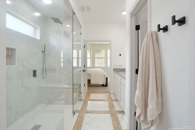 2863 Tortuga Verde, San Antonio, TX 78245 - ensuite bathroom with a tile shower, marble tiled flooring, vanity, and recessed lighting