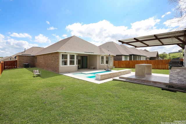 2863 Tortuga Verde, San Antonio, TX 78245 - rear view of house with a fenced backyard, a patio area, brick siding, and a shingled roof