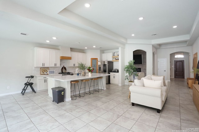 2863 Tortuga Verde, San Antonio, TX 78245 - kitchen featuring a breakfast bar, open floor plan, white cabinetry, light countertops, and recessed lighting