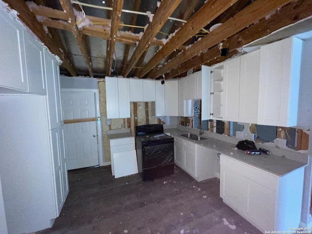 103 Saint Martin, San Antonio, TX 78202 - kitchen featuring range and white cabinetry