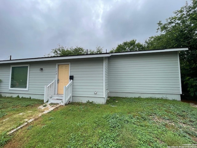 103 Saint Martin, San Antonio, TX 78202 - rear view of property with entry steps and a lawn