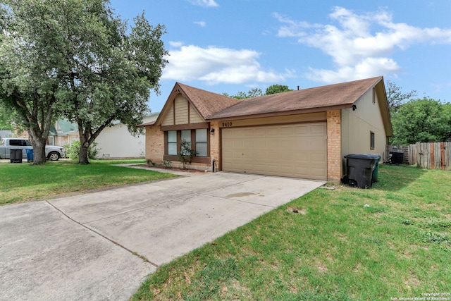 3410 Lone Valley St, San Antonio, TX 78247 - view of front of house with driveway, a garage, and brick siding