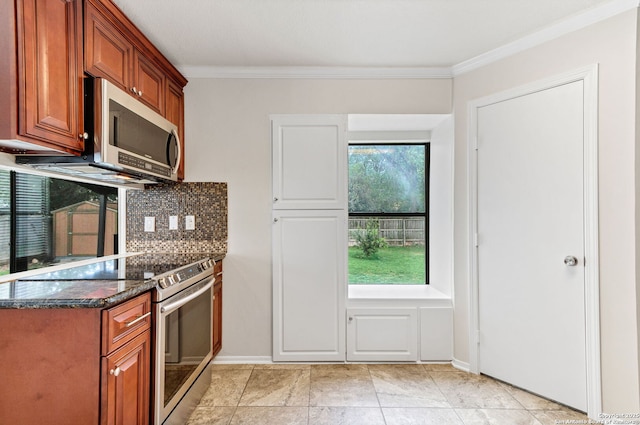 3410 Lone Valley St, San Antonio, TX 78247 - kitchen featuring appliances with stainless steel finishes, backsplash, brown cabinetry, ornamental molding, and dark stone countertops