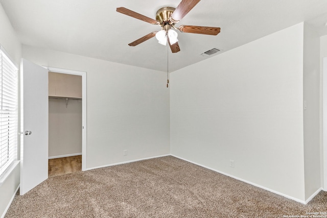 3410 Lone Valley St, San Antonio, TX 78247 - unfurnished bedroom featuring carpet, a walk in closet, a closet, and a ceiling fan