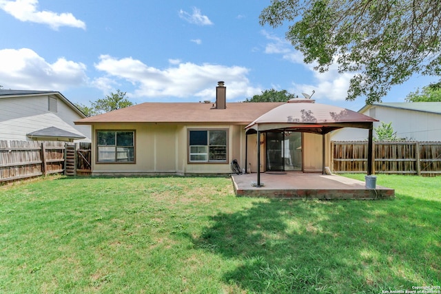 3410 Lone Valley St, San Antonio, TX 78247 - back of property with a patio, a fenced backyard, and a chimney