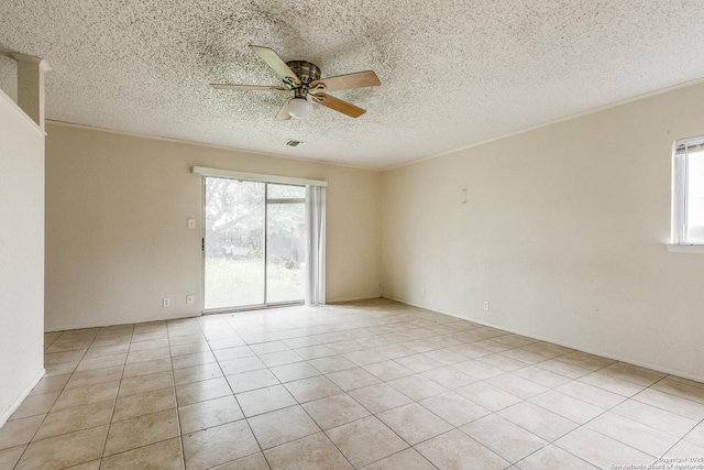 14410 Briarberry, San Antonio, TX 78247 - spare room with healthy amount of natural light, a ceiling fan, a textured ceiling, and light tile patterned floors