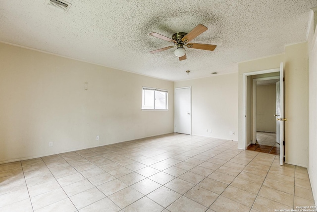 14410 Briarberry, San Antonio, TX 78247 - spare room with ceiling fan, light tile patterned floors, and a textured ceiling