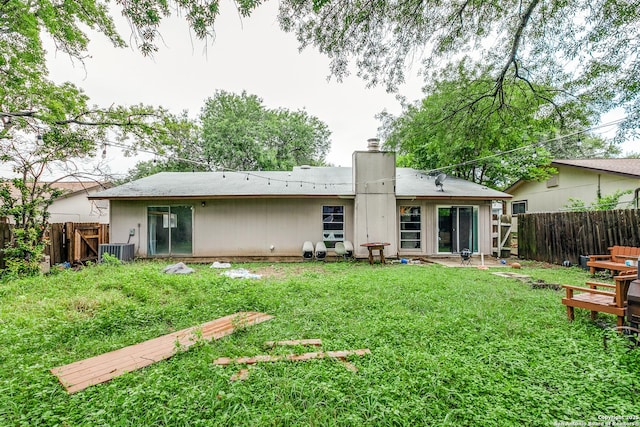 14410 Briarberry, San Antonio, TX 78247 - rear view of property with a fenced backyard and a chimney