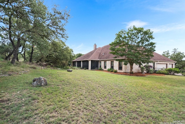 106 Oak Meadow Ln, Boerne, TX 78006 - view of green lawn with a garage and a sunroom