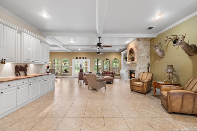 106 Oak Meadow Ln, Boerne, TX 78006 - living room featuring recessed lighting, beam ceiling, light tile patterned flooring, ceiling fan, and a fireplace
