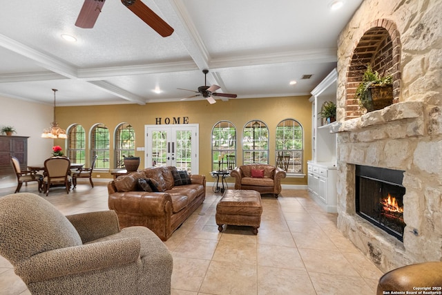 106 Oak Meadow Ln, Boerne, TX 78006 - living room featuring ceiling fan, a stone fireplace, light tile patterned flooring, ornamental molding, and coffered ceiling