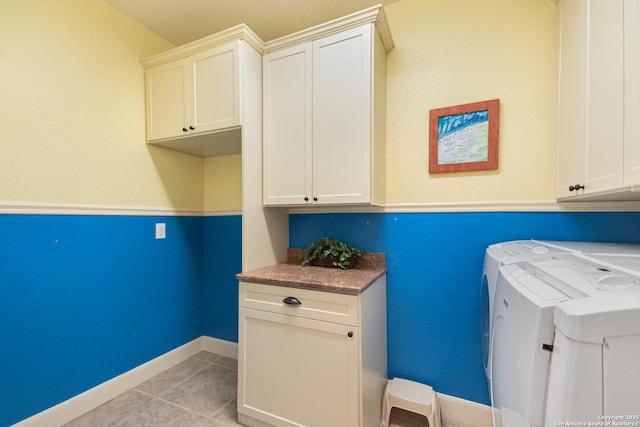 106 Oak Meadow Ln, Boerne, TX 78006 - laundry room with washing machine and clothes dryer, cabinet space, and light tile patterned floors