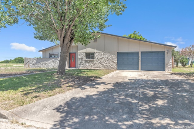 426 E Lindbergh, Universal City, TX 78148 - mid-century inspired home with an attached garage, concrete driveway, and stone siding