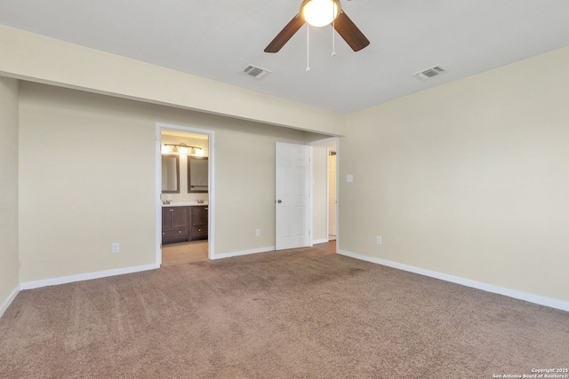 426 E Lindbergh, Universal City, TX 78148 - unfurnished bedroom with light carpet, ensuite bath, and a ceiling fan