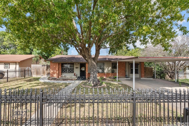 9327 Odem, San Antonio, TX 78224 - single story home with brick siding, a fenced front yard, and a carport
