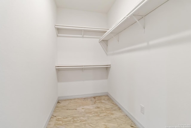 10302 Renova, San Antonio, TX 78214 - walk in closet featuring light marble finish flooring