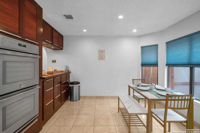 9647 Spring Harvest, San Antonio, TX 78254 - kitchen with double oven, recessed lighting, a textured ceiling, and light tile patterned flooring