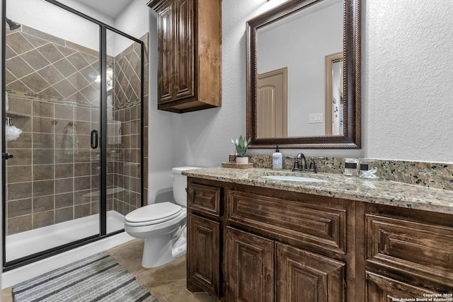 27306 Dana Crk, Boerne, TX 78015 - full bathroom with vanity, a shower stall, a textured wall, and tile patterned floors