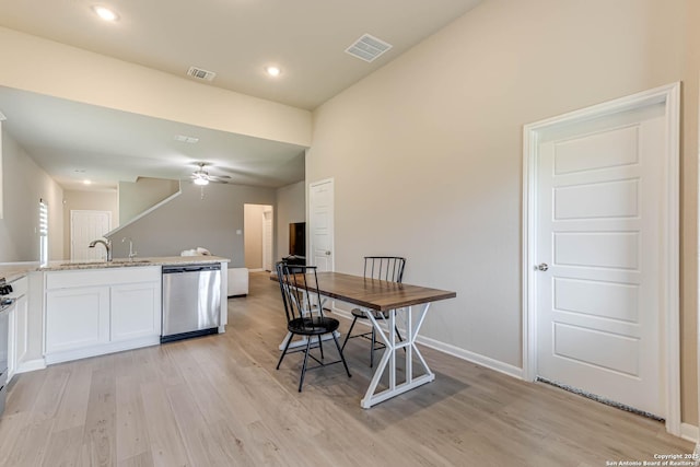 13609 Mineral Wl, San Antonio, TX 78253 - kitchen featuring dishwasher, light wood-style flooring, a ceiling fan, white cabinets, and open floor plan