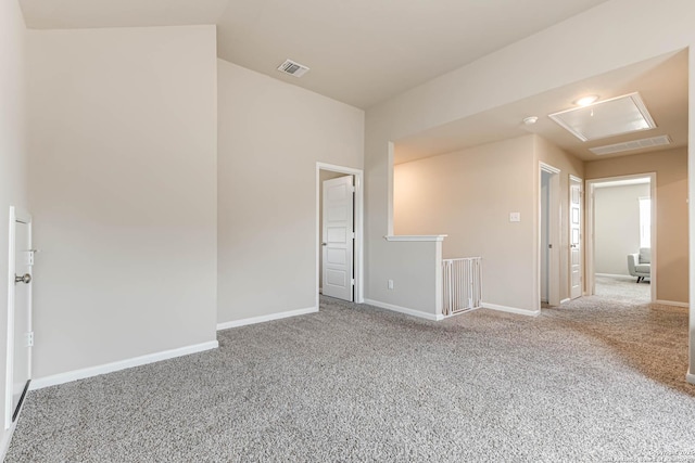 13609 Mineral Wl, San Antonio, TX 78253 - empty room featuring attic access, carpet flooring, and vaulted ceiling