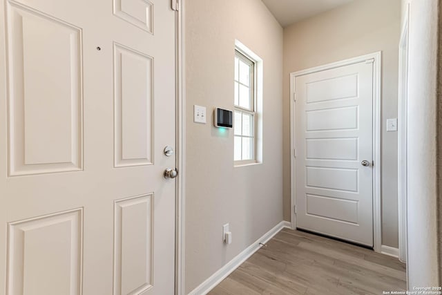 13609 Mineral Wl, San Antonio, TX 78253 - doorway to outside featuring light wood-style flooring and baseboards