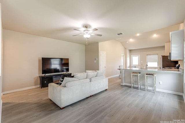 13609 Mineral Wl, San Antonio, TX 78253 - living room featuring light wood-style flooring, ceiling fan, vaulted ceiling, and recessed lighting