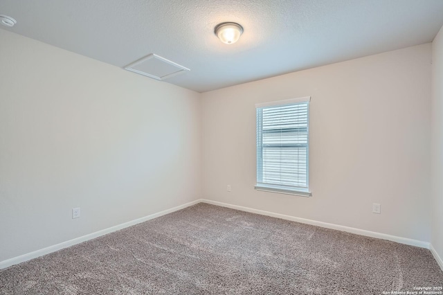 8904 Portobello Way, Converse, TX 78109 - spare room with carpet, attic access, a smoke detector, and a textured ceiling