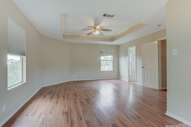 11906 Creek Peak, San Antonio, TX 78253 - spare room with a tray ceiling, a ceiling fan, wood finished floors, and a smoke detector