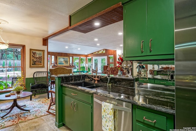505 Winfield Blvd, Windcrest, TX 78239 - kitchen with green cabinets, stainless steel appliances, a textured ceiling, a peninsula, and recessed lighting