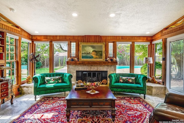 505 Winfield Blvd, Windcrest, TX 78239 - sunroom with a textured ceiling, healthy amount of natural light, wooden walls, and vaulted ceiling