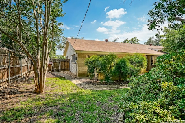 505 Winfield Blvd, Windcrest, TX 78239 - rear view of house with a fenced backyard and brick siding