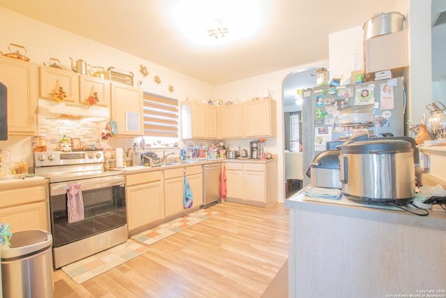 9075-1 W Foxgrove Way, San Antonio, TX 78251 - kitchen featuring appliances with stainless steel finishes, under cabinet range hood, light wood-type flooring, and light countertops