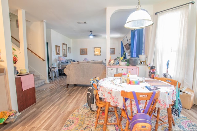 9075-1 W Foxgrove Way, San Antonio, TX 78251 - dining room featuring stairway, light wood-type flooring, and a ceiling fan