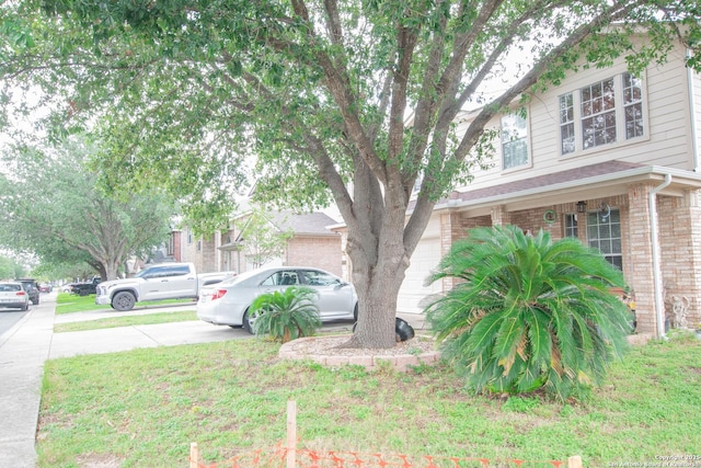 9075-1 W Foxgrove Way, San Antonio, TX 78251 - view of side of home featuring brick siding and driveway