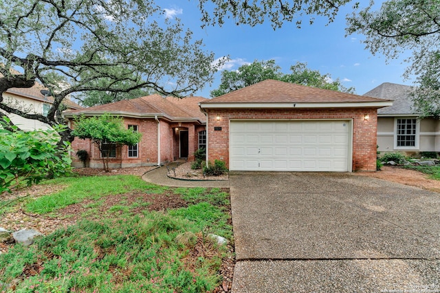 2434 Trace Oak, San Antonio, TX 78232 - ranch-style house featuring concrete driveway, an attached garage, brick siding, and roof with shingles