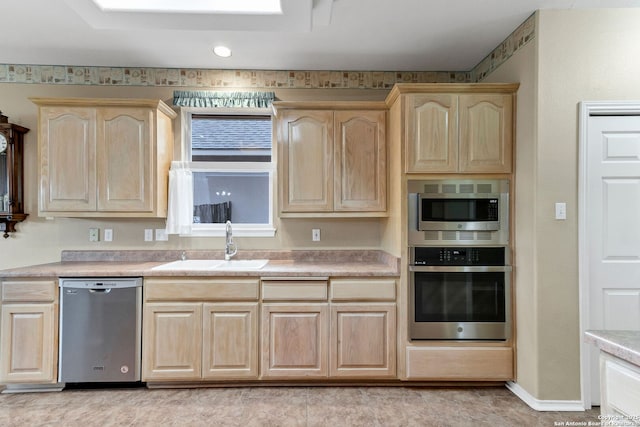 2434 Trace Oak, San Antonio, TX 78232 - kitchen featuring appliances with stainless steel finishes, light brown cabinets, and light countertops