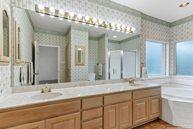 2434 Trace Oak, San Antonio, TX 78232 - bathroom featuring a stall shower, double vanity, a garden tub, and wallpapered walls