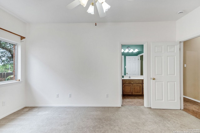 2434 Trace Oak, San Antonio, TX 78232 - unfurnished bedroom with light colored carpet, connected bathroom, and ceiling fan