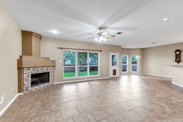 2434 Trace Oak, San Antonio, TX 78232 - unfurnished living room with healthy amount of natural light, a fireplace, ceiling fan, recessed lighting, and tile patterned floors