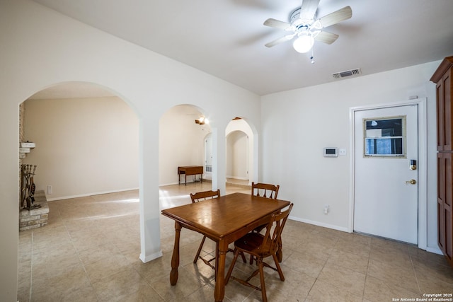 2814 Rim Rock, San Antonio, TX 78251 - dining area with arched walkways, ceiling fan, and light tile patterned flooring