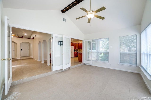 2814 Rim Rock, San Antonio, TX 78251 - empty room with arched walkways, a ceiling fan, light tile patterned floors, beamed ceiling, and high vaulted ceiling