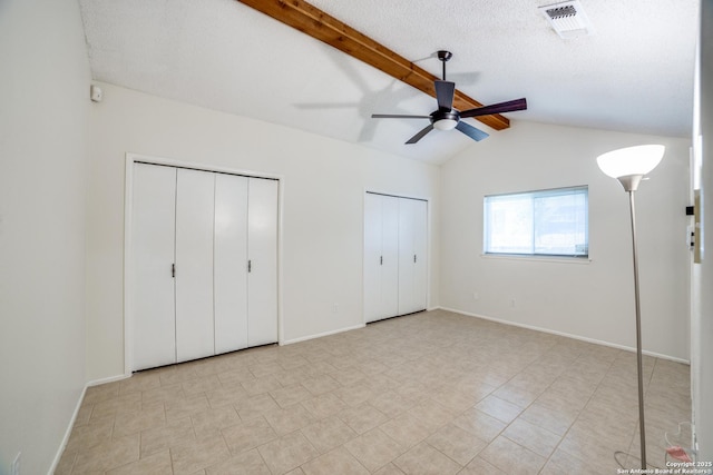2814 Rim Rock, San Antonio, TX 78251 - unfurnished bedroom with two closets, tile patterned flooring, and a ceiling fan