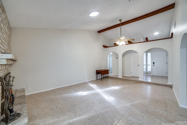 2814 Rim Rock, San Antonio, TX 78251 - unfurnished living room featuring arched walkways, a ceiling fan, light tile patterned floors, a fireplace, and a textured ceiling