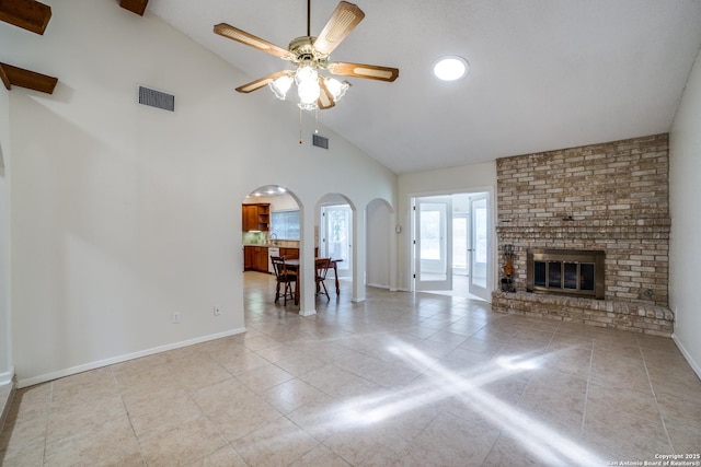 2814 Rim Rock, San Antonio, TX 78251 - tiled living room featuring arched walkways, ceiling fan, high vaulted ceiling, and a brick fireplace