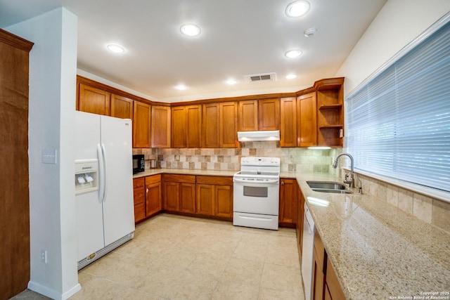 2814 Rim Rock, San Antonio, TX 78251 - kitchen featuring white appliances, under cabinet range hood, brown cabinetry, backsplash, and open shelves