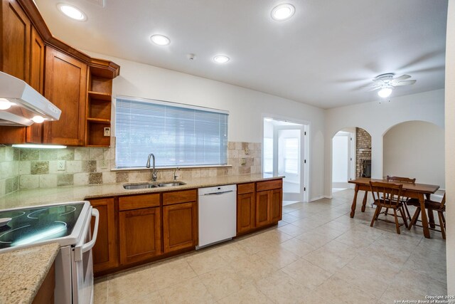 2814 Rim Rock, San Antonio, TX 78251 - kitchen featuring white appliances, arched walkways, brown cabinets, backsplash, and a ceiling fan