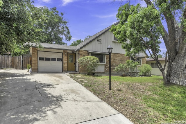 11115 Rendezvous, San Antonio, TX 78216 - view of front facade featuring brick siding, an attached garage, and driveway