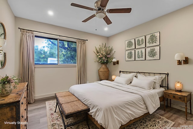 11115 Rendezvous, San Antonio, TX 78216 - bedroom with light wood-type flooring, recessed lighting, and a ceiling fan
