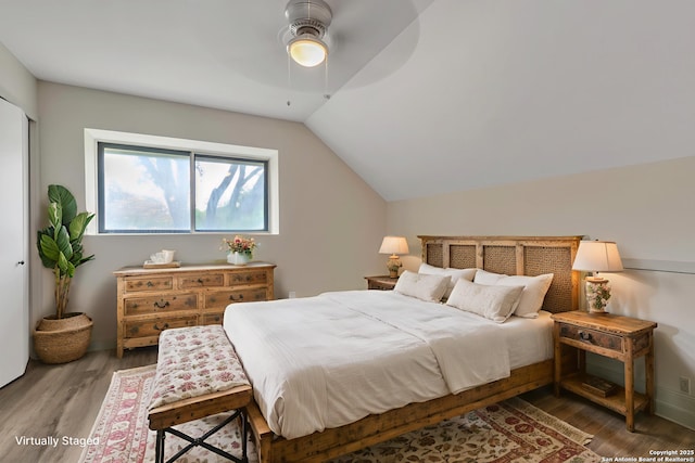 11115 Rendezvous, San Antonio, TX 78216 - bedroom featuring wood finished floors, vaulted ceiling, and a ceiling fan