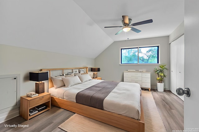11115 Rendezvous, San Antonio, TX 78216 - bedroom featuring wood finished floors, vaulted ceiling, and ceiling fan